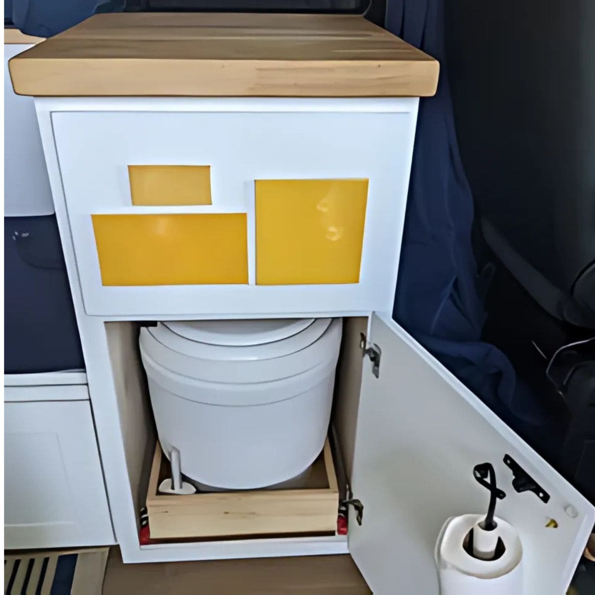 12V Powered Laveo Dry Flush Toilet Under a Cabinet